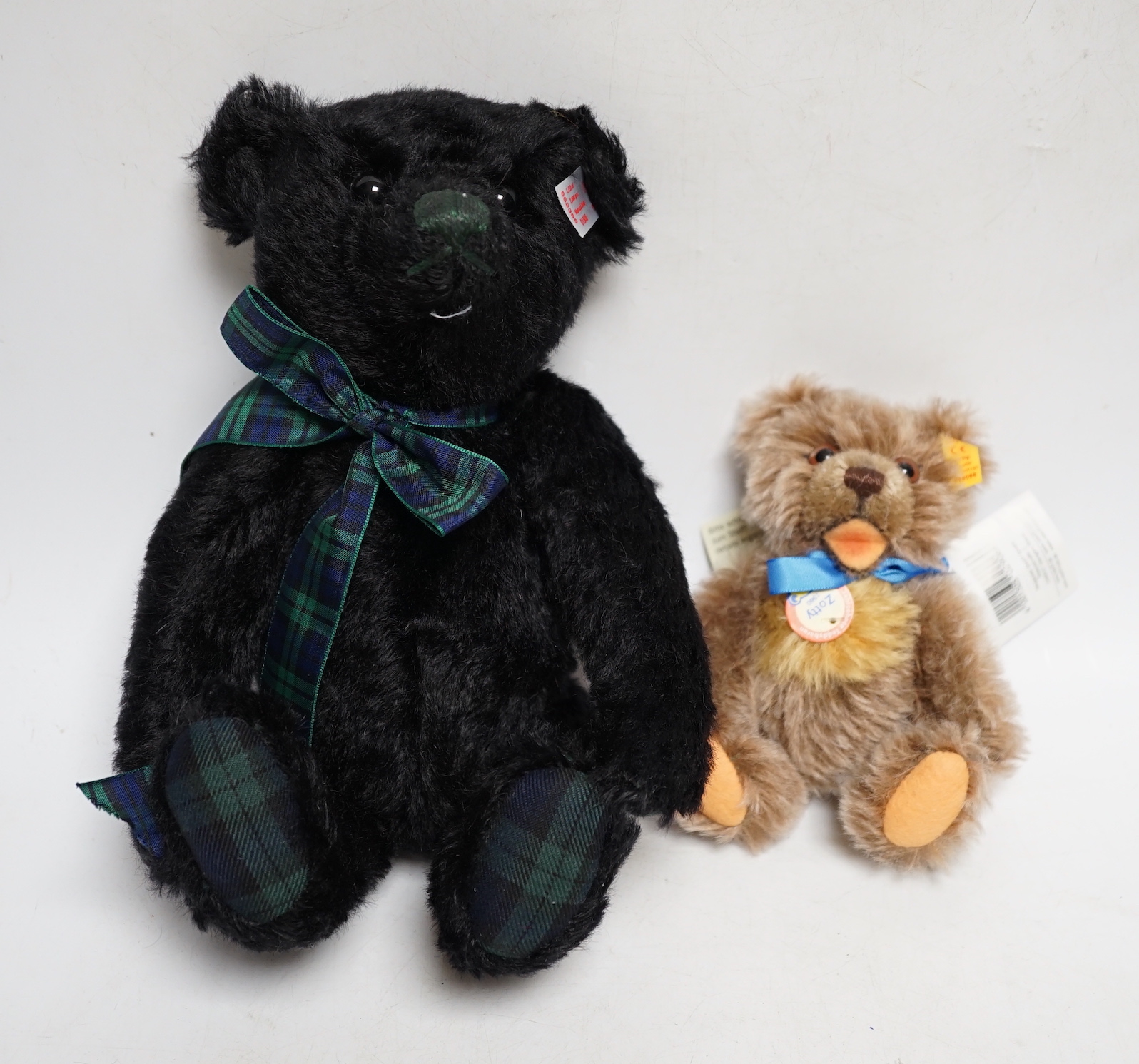 A Steiff musical Black Watch bear with bag and certificate with small Steiff Zotty yellow tag with bag